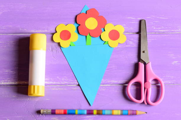 Making paper crafts for mother's day or birthday. Step. Paper flowers bouquet stock photo