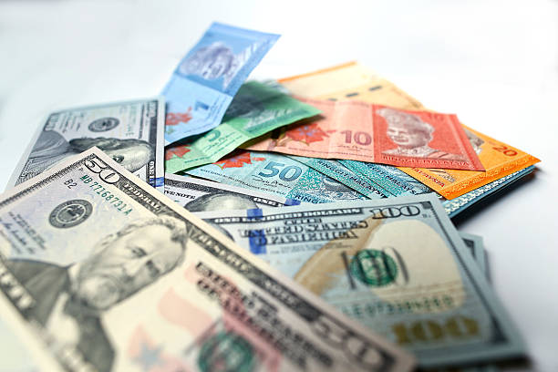 Malaysian ringgit and United States Dollar on a white background stock photo