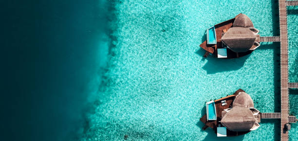 maldives island resort over water villas - maya bay imagens e fotografias de stock