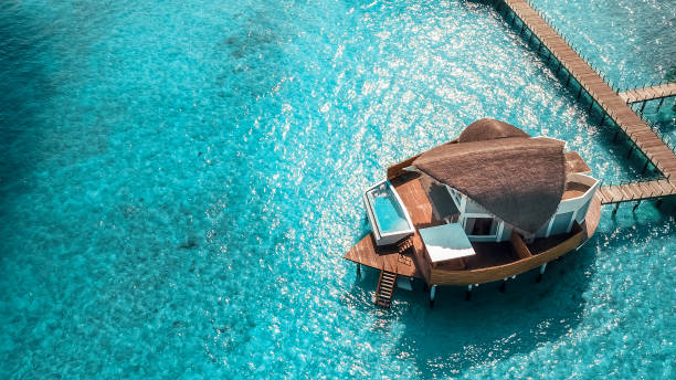 maldives island resort over water villas - maya bay imagens e fotografias de stock