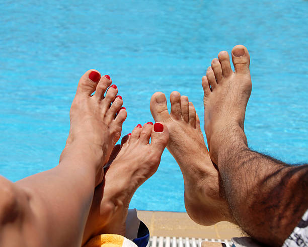 Male and female feet stock photo