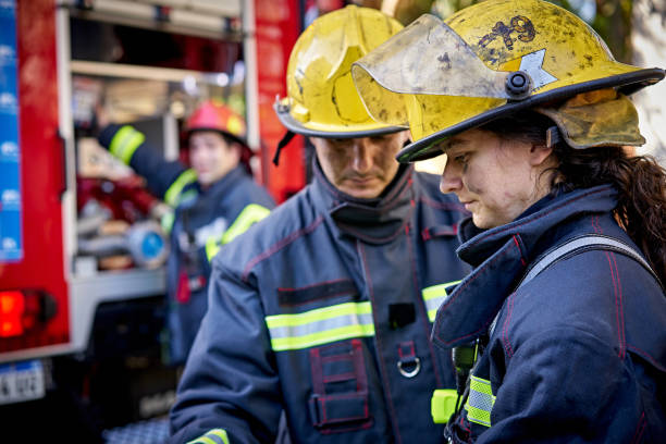 Male and Female Firefighting Teammates in 20s and 30s stock photo