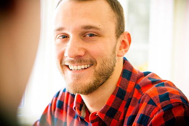 Male Client Talking and Responding to his Life Coach stock photo