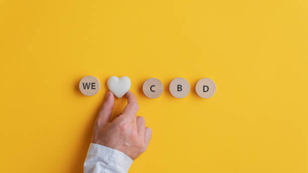 Male hand making a We love CBD sign cbd benefits stock pictures, royalty-free photos & images