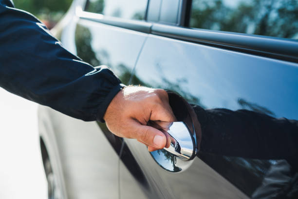 Male hand open the car door pulling the handle of a car. Male hand open the car door pulling the handle of a car. car loan stock pictures, royalty-free photos & images