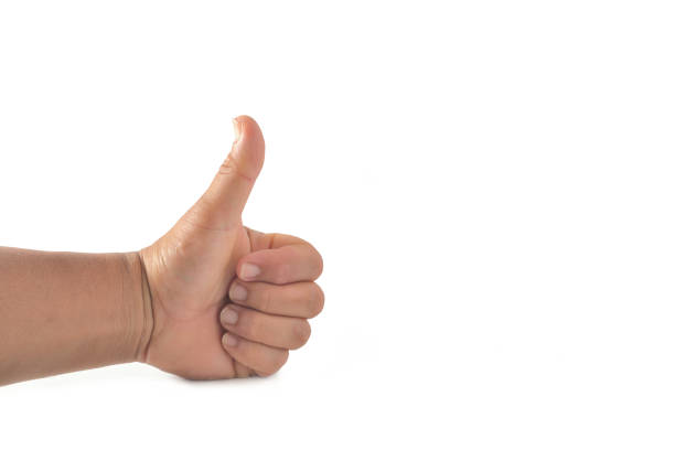 Male hand showing thumbs up sign. stock photo