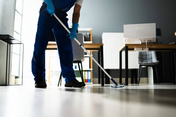 Male Janitor Mopping Floor In Face Mask Male Janitor Mopping Floor In Face Mask In Office office cleaning tasks stock pictures, royalty-free photos & images