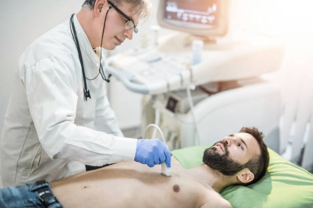 Sonologist is performing ultrasound test of patient