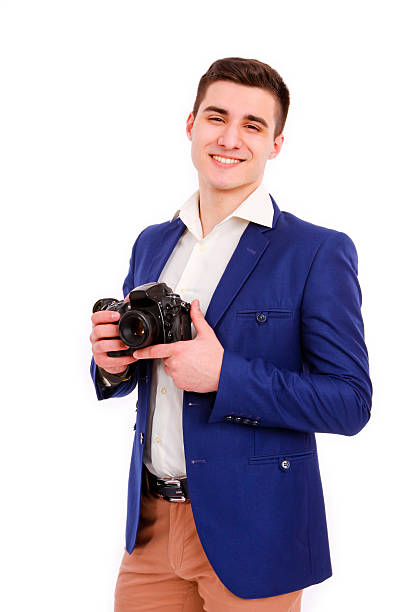 Male photographer with his camera isolated on white background stock photo