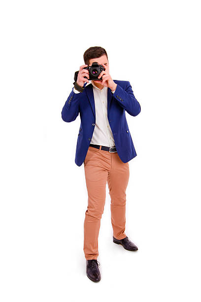 Male photographer with his camera isolated on white background stock photo