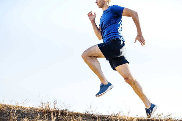 male runner run trail on light background stock photo