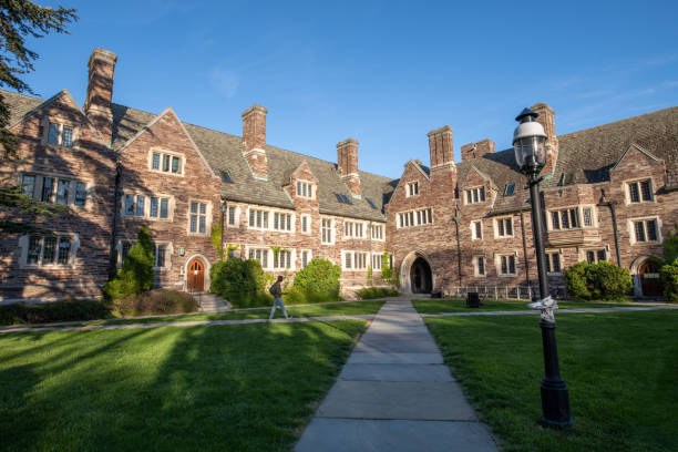 A male student walking in the campus of Princeton University stock photo
