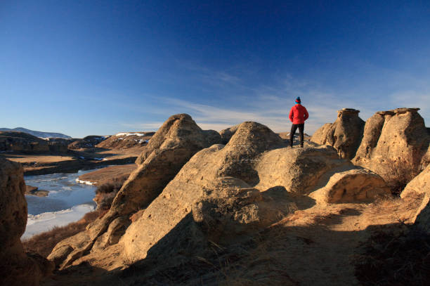Man Admiring Incredible View At Writing-On-Stone Provincial Park in Alberta Canada stock photo