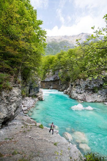 Man admiring River Soca Canyon Valley between Kobard and Bovec, Julian Alps, Slovenia, Europe stock photo