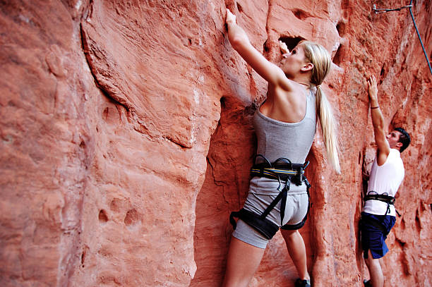 Man and woman rock climbers at St. George in Utah stock photo