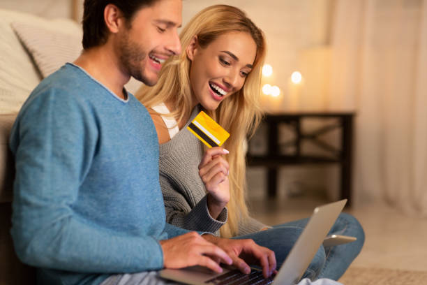 Online Shopping. Man And Woman Holding Laptop And Credit Card...