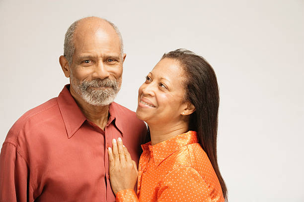 Man and woman smiling, close-up Man and woman smiling, close-up old black couple in love stock pictures, royalty-free photos & images
