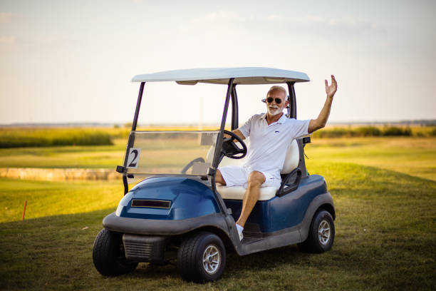 A man arrives at a golf course. stock photo