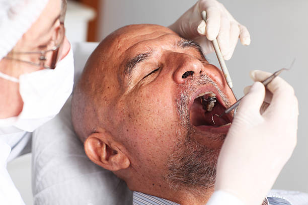 Man at the dentist stock photo
