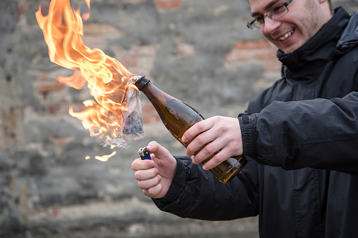 https://media.istockphoto.com/photos/man-attack-with-molotov-cocktail-picture-id946081822?k=20&amp;m=946081822&amp;s=170667a&amp;w=0&amp;h=sroUdFxxjbE7yxy86DROIxvdgT11thyZP-Apd43m6tQ=