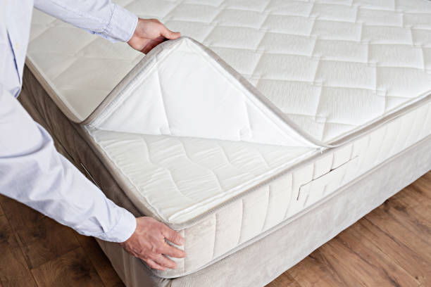 Man choosing a mattress. stock photo
