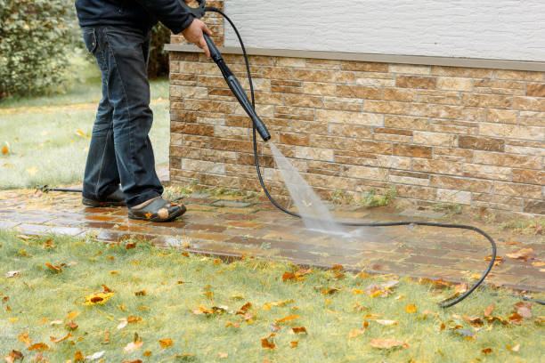 Man cleaning street with high pressure power washer, washing stone garden paths Man cleaning street with high pressure power washer, washing stone garden paths. High quality photo pressure washing stock pictures, royalty-free photos & images