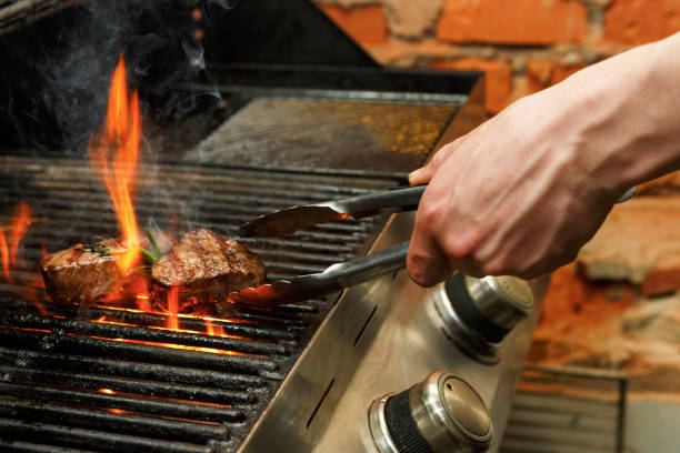 https://media.istockphoto.com/photos/man-cooking-meat-steaks-on-professional-grill-outdoors-picture-id836589598?k=6&m=836589598&s=612x612&w=0&h=k28Cj5aUpnEfdvRZM3onTRUM2Gp_-cau_sn8Hs3uf6Y=