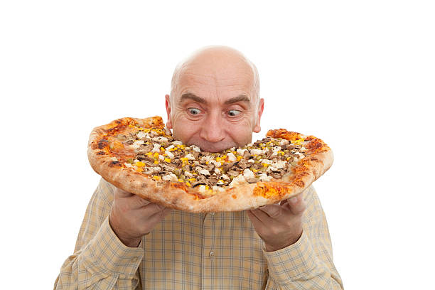 man eat pizza stock photo