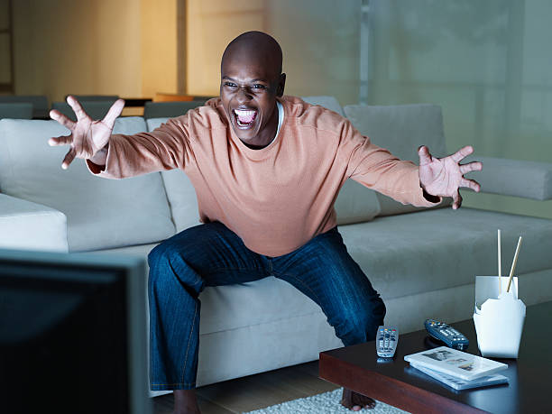 Man Watching Tv On Couch Alone Stock Photos Pictures Man Watching Tv On Couch Alone Stock Photos Pictures