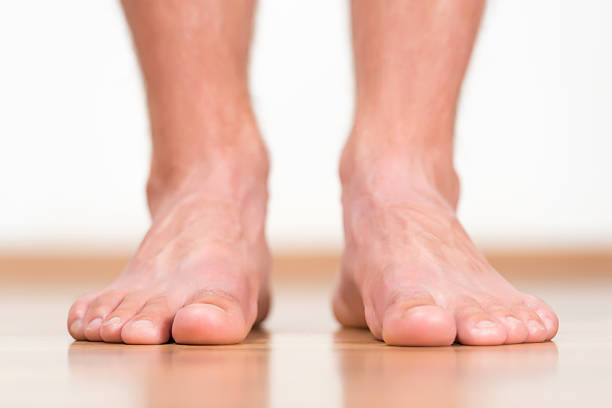 Man feet stepping on the flor Man feet stepping on the flor barefoot stock pictures, royalty-free photos & images