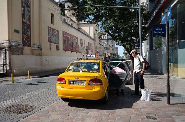 Man gets into taxi on the street near church stock photo