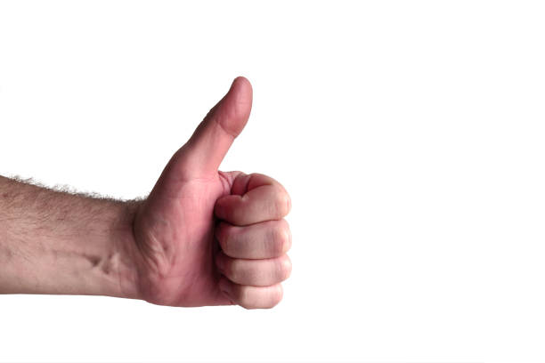 Man hand doing a thumbs up gesture isolated on white background stock photo
