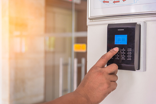 Man Hand Using Security Key Card Scanning To Open The Door
