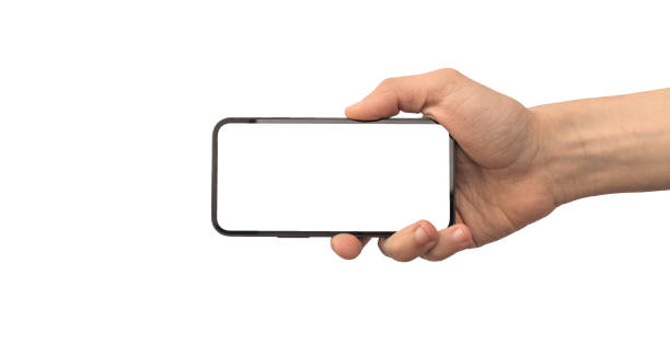 Man holding mobile phone mockup screen horizontally isolated on a white background photo Man holding mobile phone mockup screen horizontally isolated on a white background vlad model photos stock pictures, royalty-free photos & images