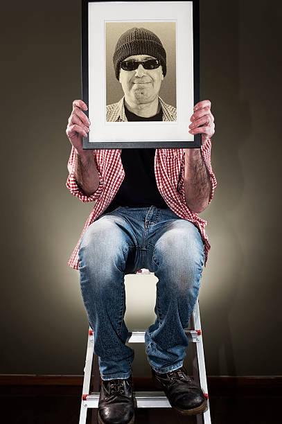 Man holding picture frame stock photo