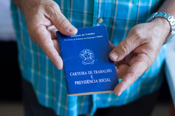 Man holding with hands Brazilian document work and social security stock photo