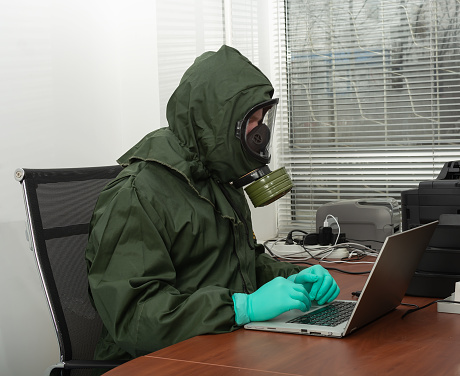 man-in-a-biohazard-protective-suit-is-wo