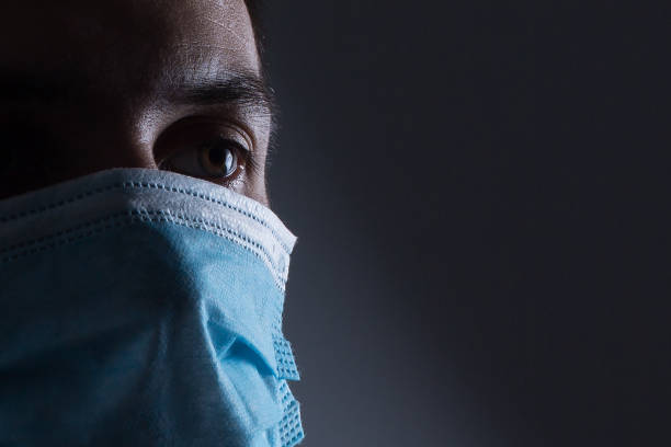 man in a protective mask, the H1N1 Virus stock photo