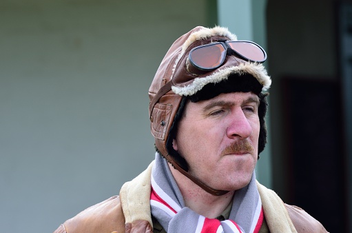 Stowe Maries Airfield England, United Kingdom - May 14, 2014: Portrait of Man in World War I flying hat  recreating uniform of Royal Air Force in world war I at flying event
