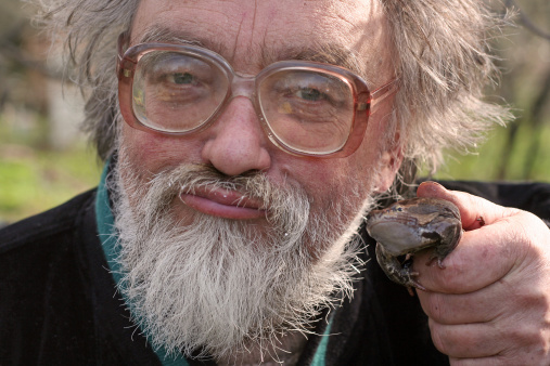 The man in glasses with a frog
