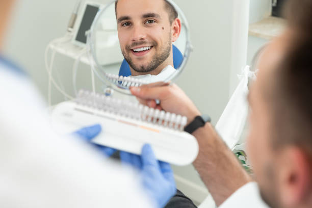 Man in stomatology clinic. Teeth whitening. stock photo