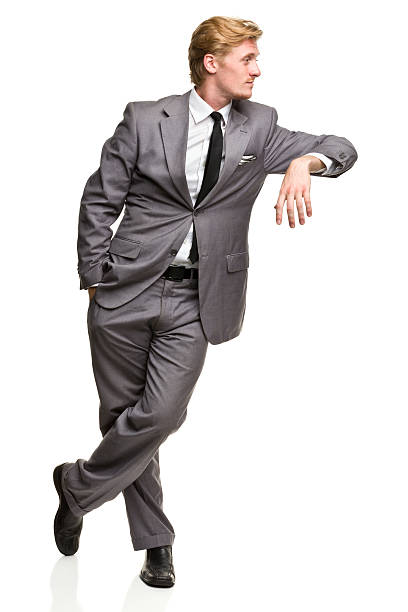 Man in Suit Leans Against Nothing Portrait of a man on a white background. http://s3.amazonaws.com/drbimages/m/ml.jpg leaning stock pictures, royalty-free photos & images