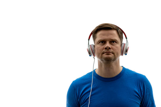 Man listens to music with headphones stock photo