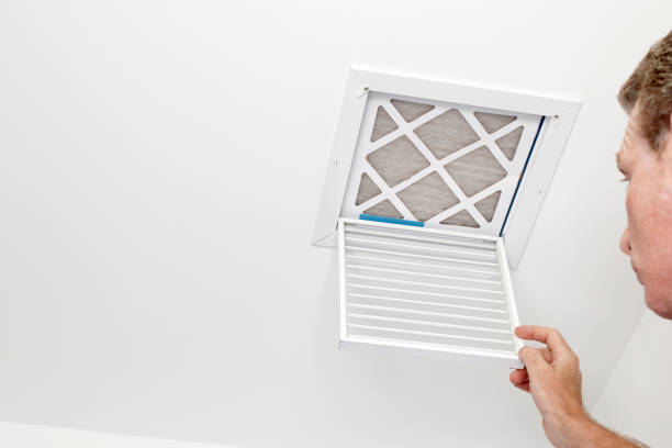 Man Opened a Vent to a Dirty Filter stock photo