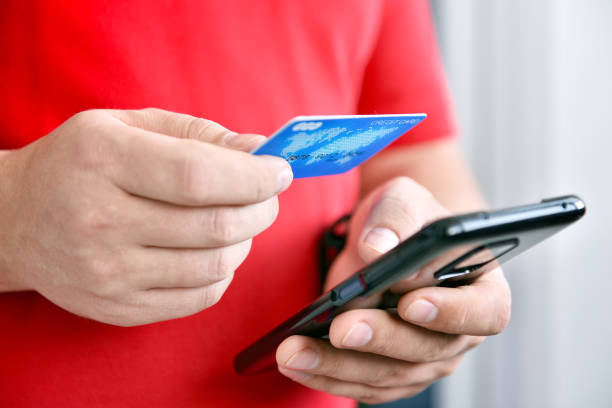 Man paying with credit card stock photo