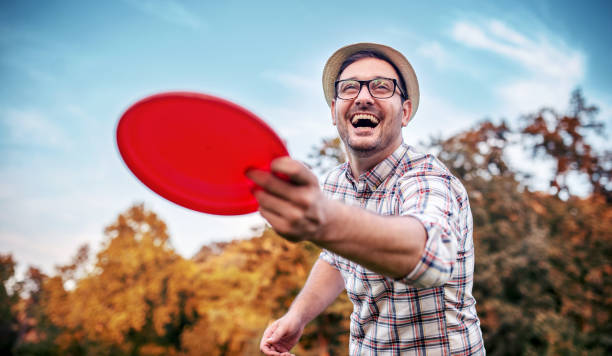 Man playing frisbee. Sport and recreation concept. stock photo