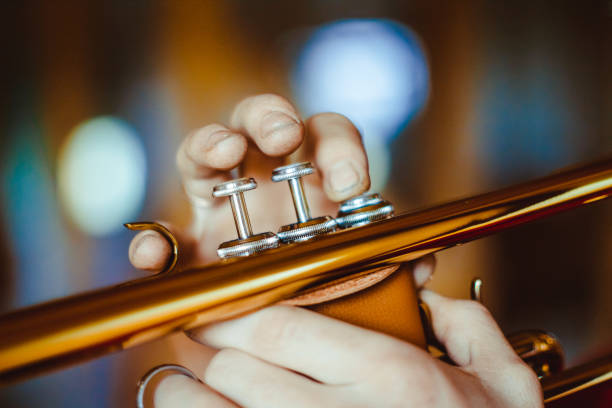 man plays the trumpet stock photo