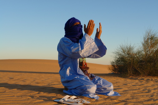 Tuareg men performing traditional dance during Ghat Festival of Culture which is held every December in Ghat City (about 1,360 km (845 miles) south of the Libyan capital, Tripoli)
