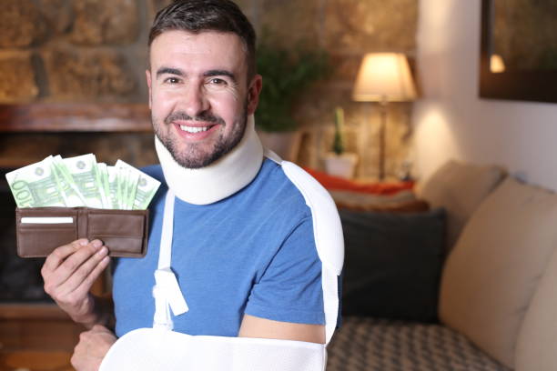 Man receiving compensation after work accident stock photo
