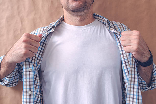 Man revealing white t-shirt as copy space for mock up graphic design